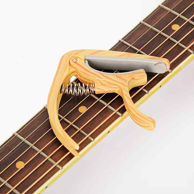 Каподастр для гітари, ABS, світле дерево. Музичний аксесуар з мішечком.