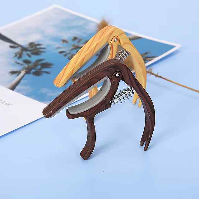 Каподастр для гітари, ABS, світле дерево. Музичний аксесуар з мішечком. - 3 фото товару