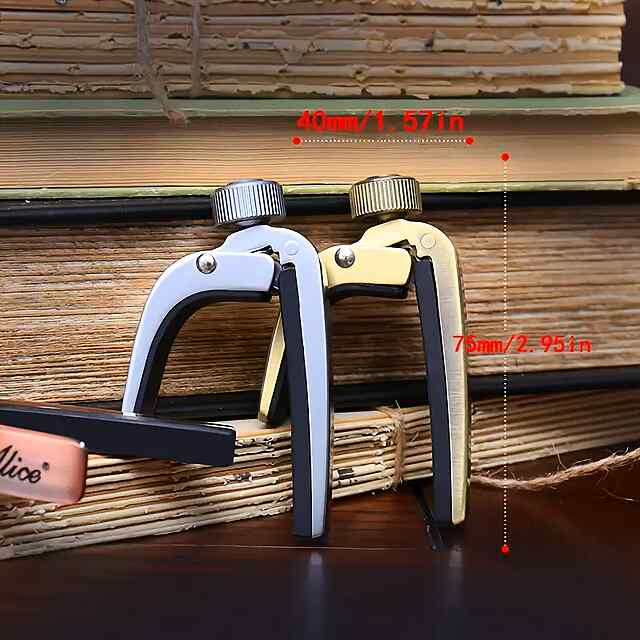 Каподастр для гітари срібного кольору, міцний та зручний - 1 фото товару